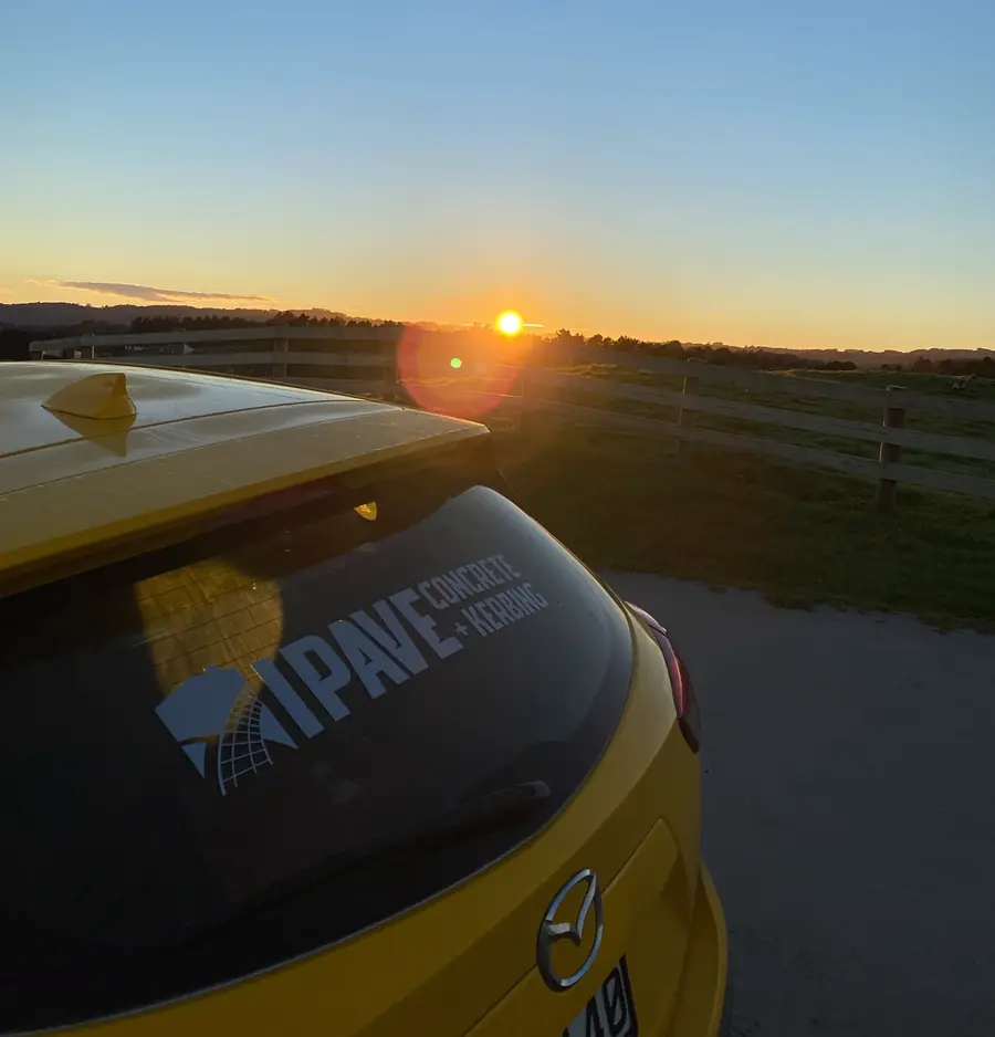 I Pave Kerbing truck on an Auckland job site at sunset